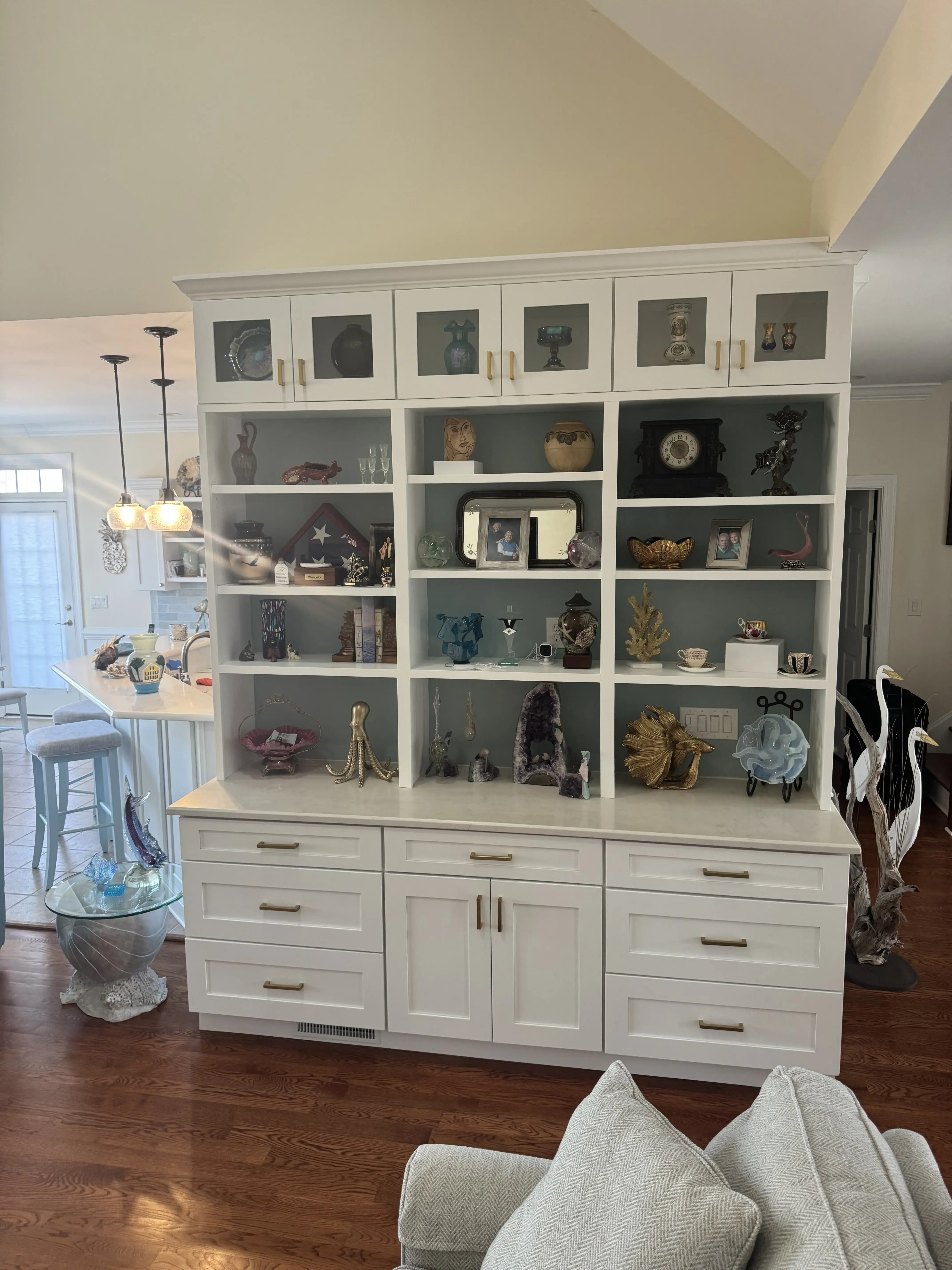 Custom built-in cabinetry with styled shelving