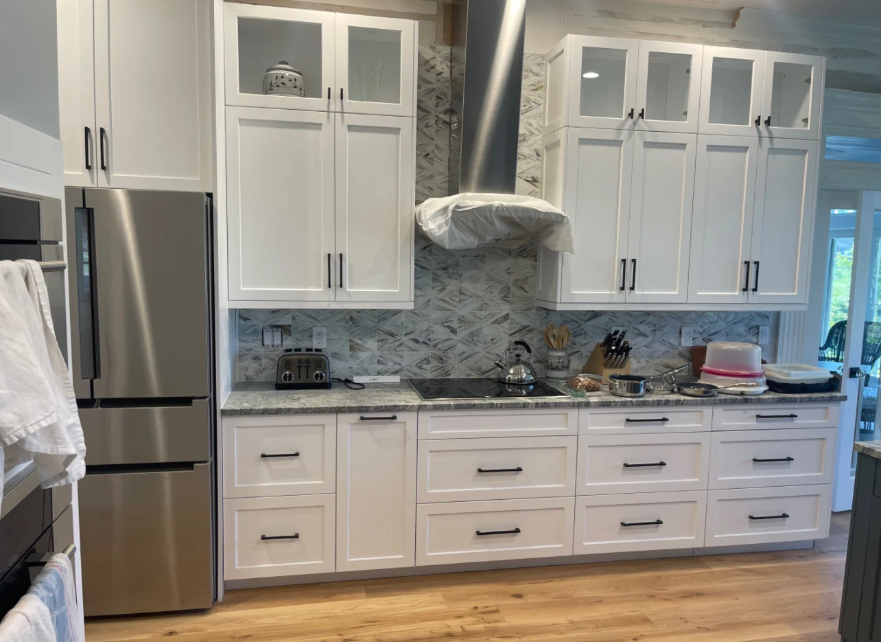 Remodeled kitchen sink and dishwasher wall with updated finishes